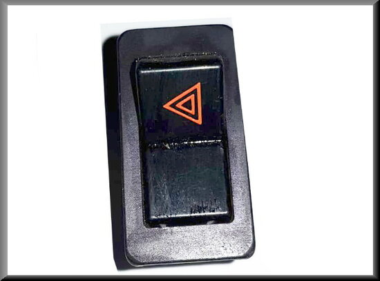 Warning light switch with chrome frame (logo in red, triangle to the left).)